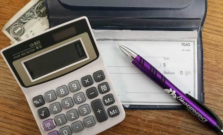 Cash, calculator, checkbook and pen