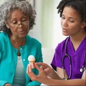 Nurse discussing medicationswith client