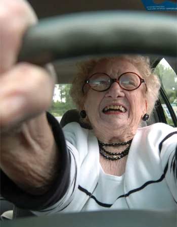 Senior lady appearing to be on a 'joy ride'